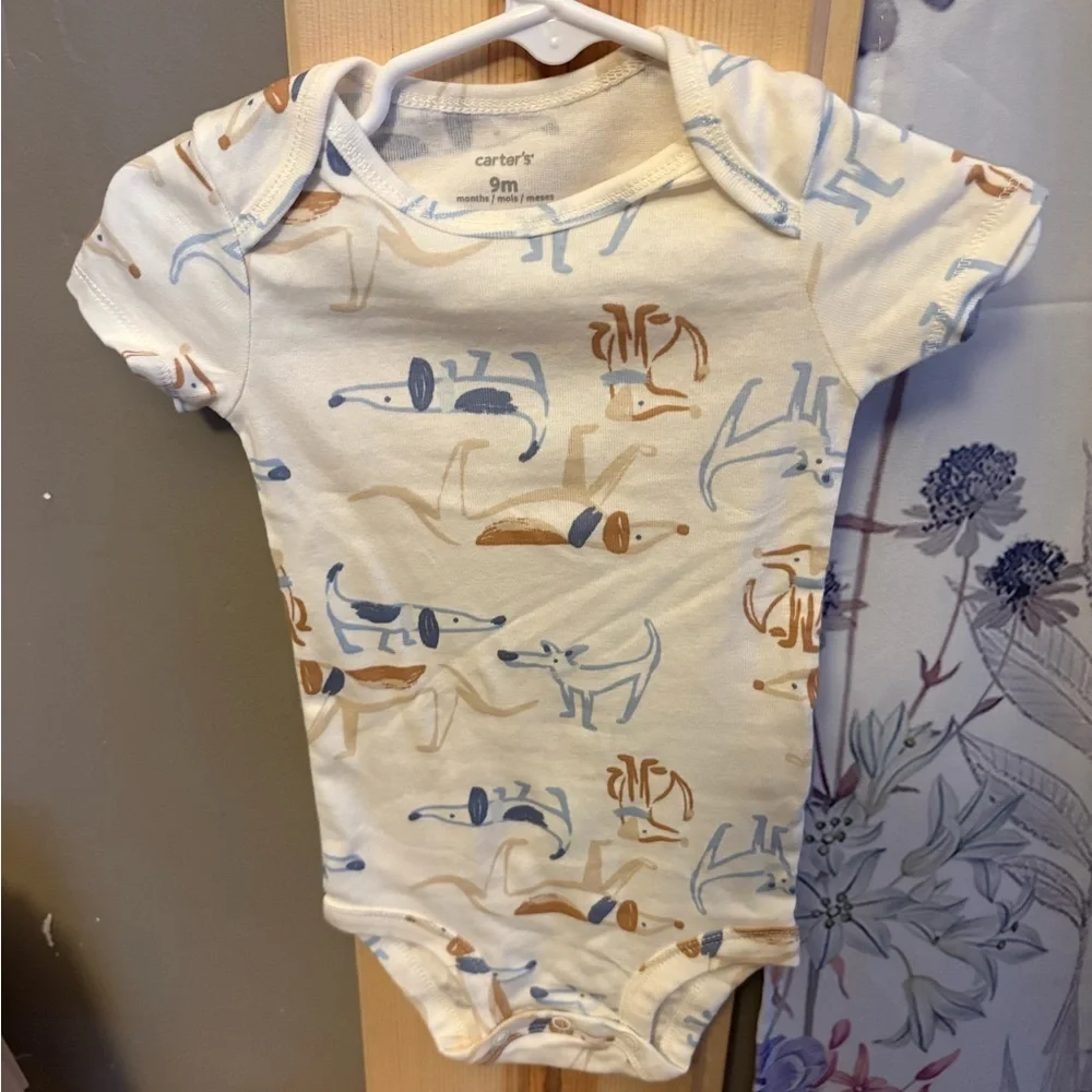Carter's Cream Bodysuit with Animal Design.  5 size 9 months onesies for $15